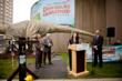 Rita Ortiz, Travelers Community Relations addresses the crowd at the Dinosaurs Unearthed opening ceremony.